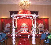BRIDE GROOM SITTING MANDAP